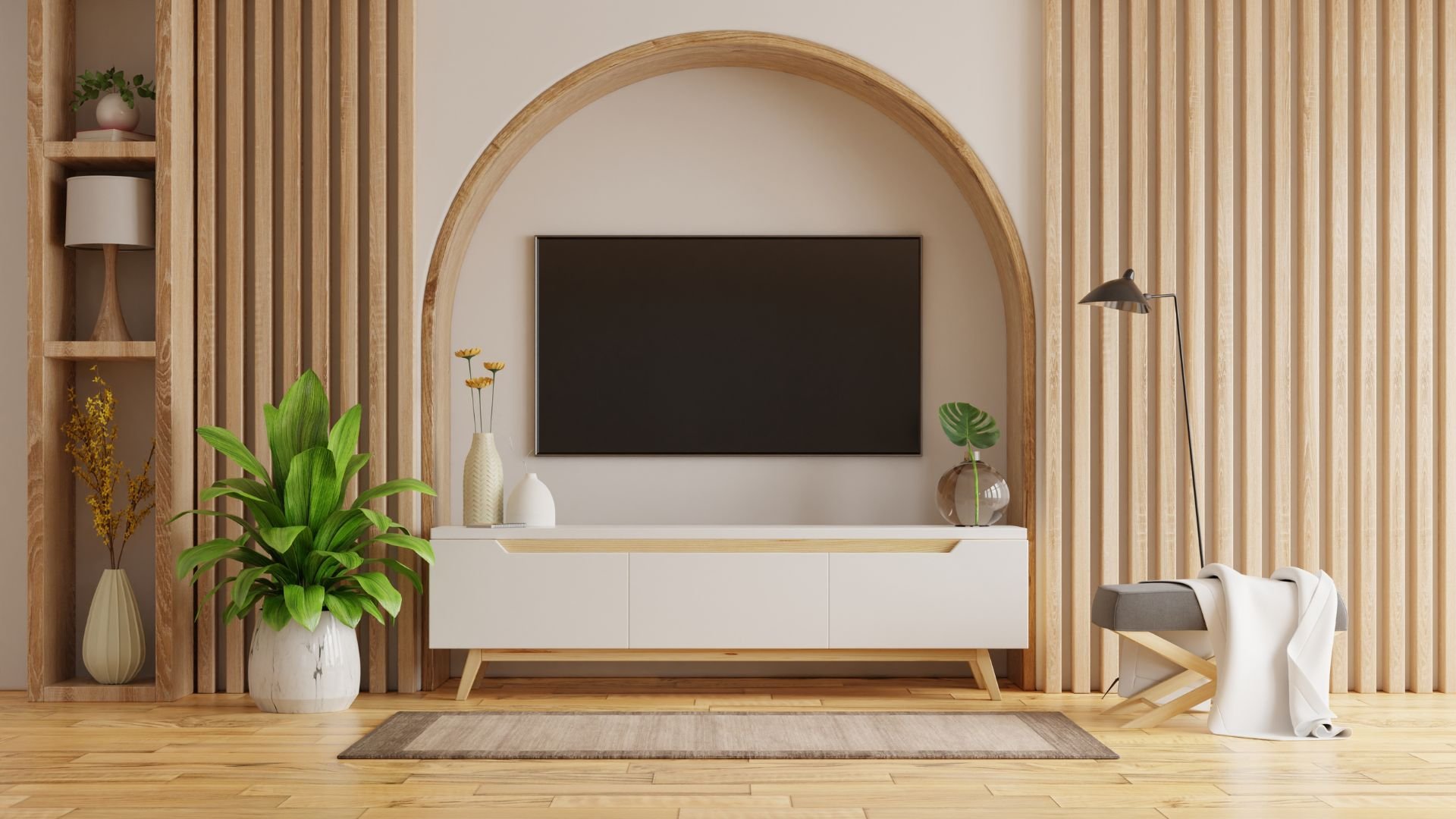 Modern living room with wooden panels, TV, plants, and minimalist decor